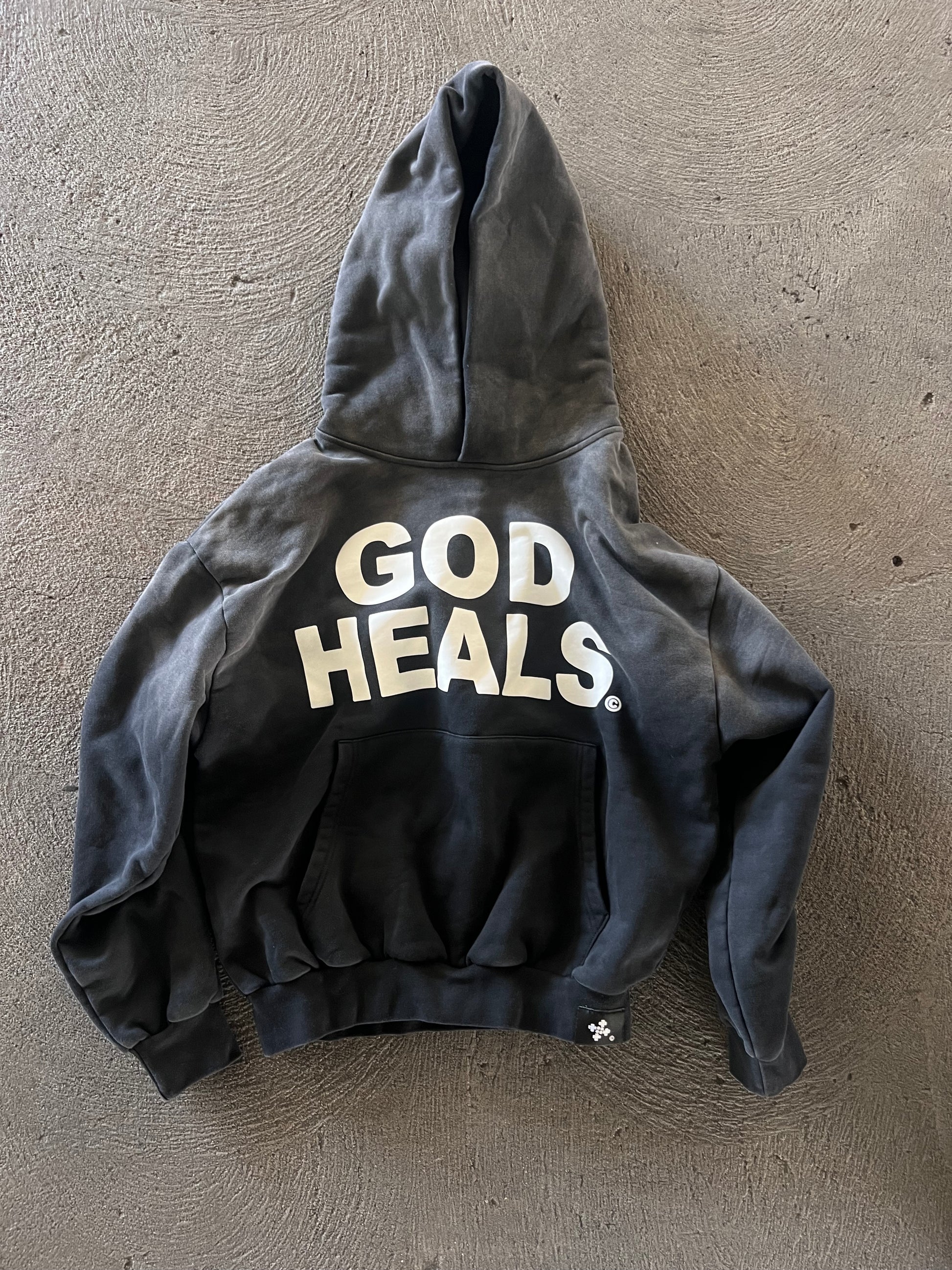 &#39;GOD HEALS&#39; WEIGHTED HOODIE